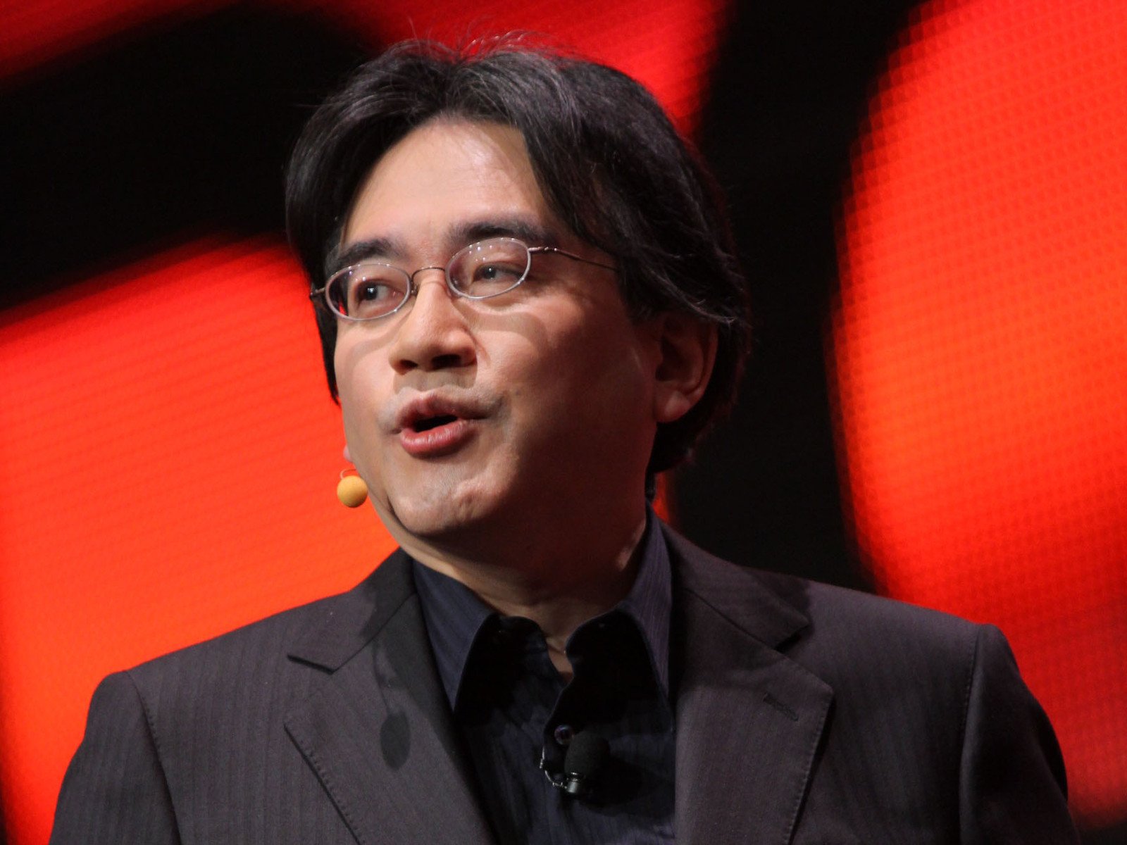 Nintendo President Satoru Iwata speaks as he unveils a Nintendo