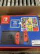 Images show new Nintendo Switch bundle with choice of Mario game and movie stickers