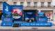The PlayStation Stand on Regent Street in London featuring a giant EA FC 24 case and disk with a seating area and various televisions.