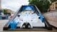 A large white and blue pinball set in London with various PlayStation brandings.