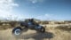 Sam Bridges rides a bike through the desert.